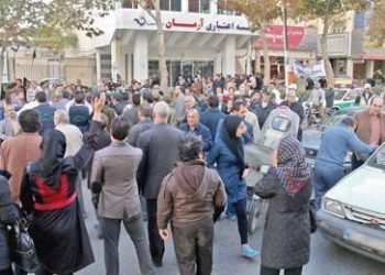 A woman gets arrested in Mashhad for documenting protests