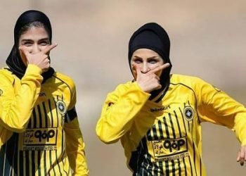 Yellow card for female footballers whose hair shows off