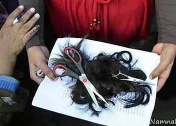 Forcible hair-cut for girls who do not properly cover their hair