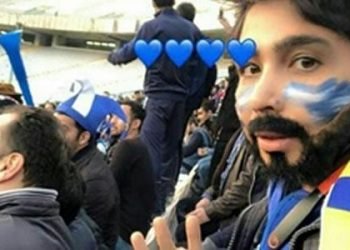A young woman enters a football stadium by posing as a man