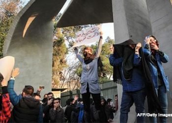 Protesting women confront security forces