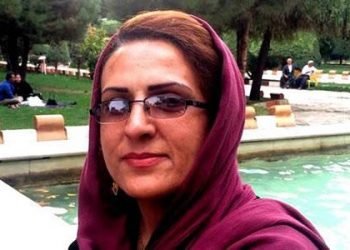 An activist Kurdish woman on trial in Saqqez